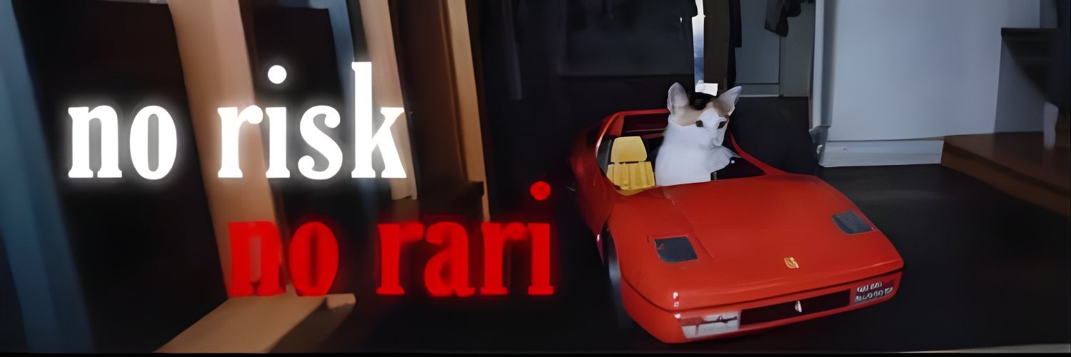 White bunny driving a red Ferrari